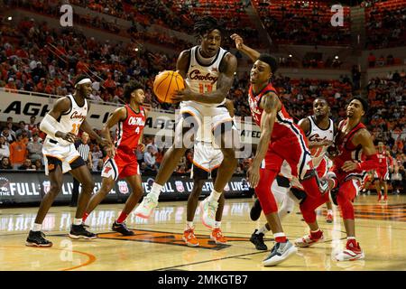 Oklahoma State's Quion Williams (13) brings the ball up the court during  the first half of an NCAA college basketball game against Mississippi in  Stillwater, Okla., Saturday, Jan. 28, 2023. (AP Photo/Mitch