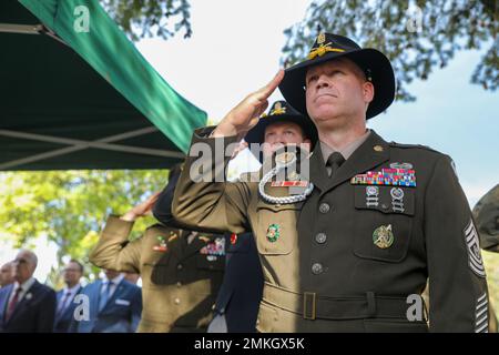 U.S. Army Command Sgt. Maj. Christopher A. Prosser, V Corps command sergeant major Forward, renders a salute during the Polish national anthem at a memorial roll call during Polish Land Forces Black Division Holiday celebration at Tanker’s Square, Żagań, Poland, Sept. 9, 2022. The 3/4th ABCT is among other units assigned to the 1st Infantry Division, proudly working alongside NATO allies and regional security partners to provide combat-credible forces to V Corps, America’s forward-deployed corps in Europe. Stock Photo