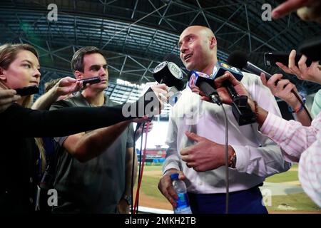 Miami Marlins baseball team CEO Derek Jeter, center, speaks to members of  the media inside Marlins Park stadium, Monday, Feb. 11, 2019, in Miami.  Jeter is entering his second season as CEO