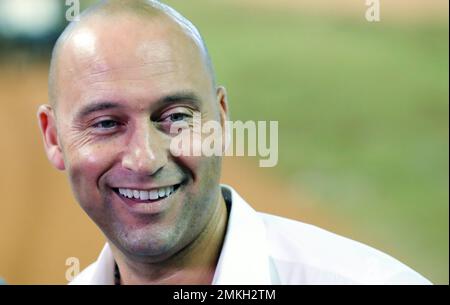 Miami Marlins baseball team CEO Derek Jeter, center, speaks to members of  the media inside Marlins Park stadium, Monday, Feb. 11, 2019, in Miami.  Jeter is entering his second season as CEO