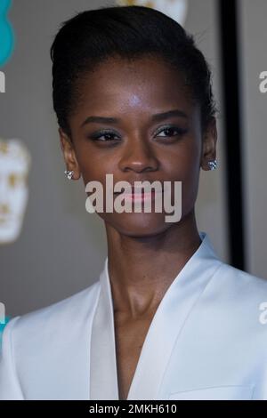 Letitia Wright poses for photographers upon arrival at the 75th