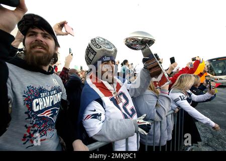 Buses carrying Los Angeles Rams players and coaches drive past fans during  the team's victory parade in Los Angeles, Wednesday, Feb. 16, 2022,  following their win Sunday over the Cincinnati Bengals in