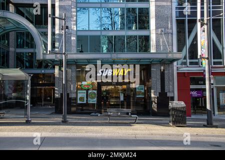 Storefront of Subway in Downtown Vancouver. Subway is US fast food restaurant franchise specializes in submarine sandwiches (subs), wraps and drinks Stock Photo