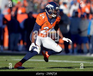 Denver Broncos safety Steve Atwater (27) jumps into the air in an