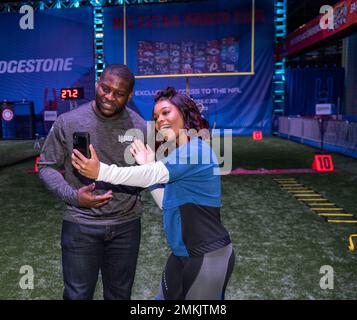 IMAGE DISTRIBUTED FOR BARCLAYS - Hall of Fame Running Back LaDainian  Tomlinson runs drills with a young fan during a VIP clinic, hosted by the  NFL Extra Points Credit Card issued by