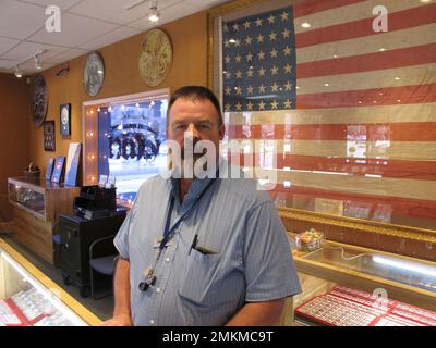 Allen Rowe owner of Northern Nevada Coin poses for a photo