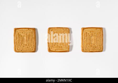 Top view of sweet tasty shortbread homemade square shaped cookies isolated on white background Stock Photo