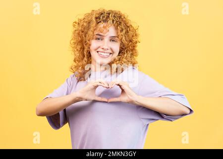 Woman representing a heart in the shape of fingers Stock Photo