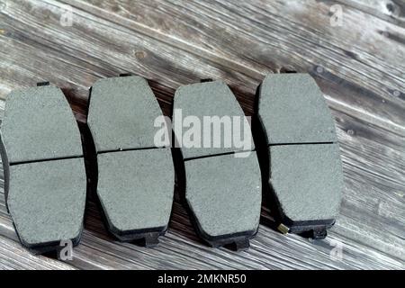 selective focus of a set of new unused auto brake pads for a car isolated on white, car service and maintenance concept, spare parts for a car, steel Stock Photo