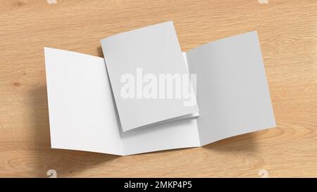 Trifold brochure A4 booklet mockup on wooden background Stock Photo