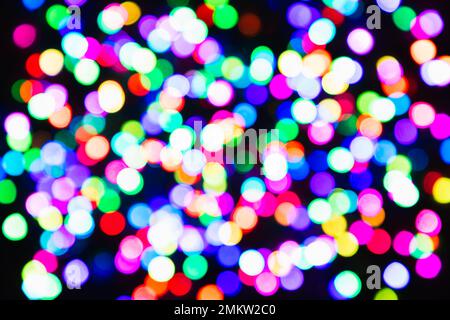 Blurred defocused abstract multicoloured light confetti on a black background Stock Photo