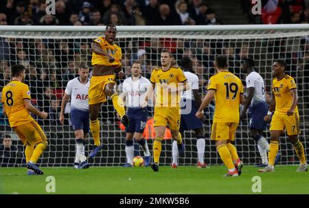 Wolverhampton Wanderers Willy Boly leaps up as he celebrates scoring his sides 1st goal during their English Premier League soccer match between Tottenham Hotspur and Wolverhampton Wanderers at Wembley stadium in London, Saturday, Dec. 29, 2018. (AP Photo/Kirsty Wigglesworth)