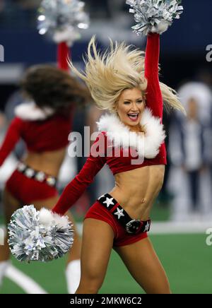 The Dallas Cowboys Cheerleaders perform wearing a holiday costume during an  NFL football game against the Tampa Bay Buccaneers on Sunday, Dec. 23,  2018, in Arlington, Texas. (AP Photo/Ron Jenkins Stock Photo 