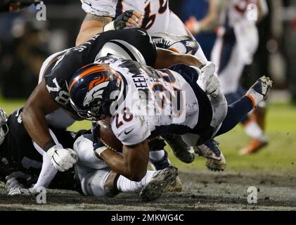 Denver Broncos running back Royce Freeman (28) rushes with the ball as he  eyes a defender during an NFL football game, Monday, Sept. 9, 2019, in  Oakland, Calif. (AP Photo/Peter Joneleit Stock