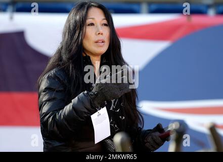 Buffalo Bills co-owner Kim Pegula, center, stands with others on the field  watching warmups before an NFL football game against the Dallas Cowboys in  Arlington, Texas, Thursday, Nov. 28, 2019. (AP Photo/Michael