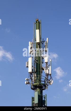 An antenna and mobile phone tower. Telecommunication tower of 4G and 5G cellular. Cell Site Base Station. Stock Photo