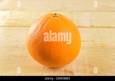 orange isolated on a table of wooden Stock Photo