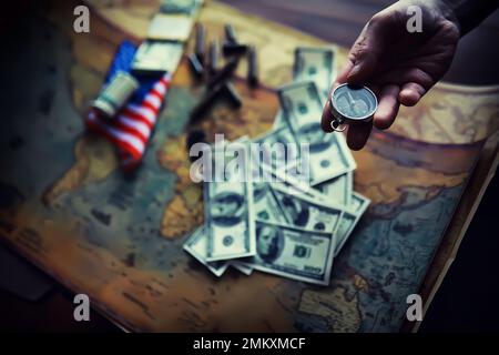 Magnetic compass. The concept of finding successful solutions to problems. Compass, map, sleeves, hands. Stock Photo