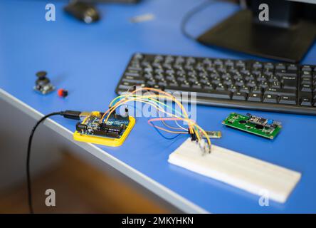 engineers assemble electrical circuits from radio components in a laboratory Stock Photo
