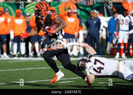 FILE - Cincinnati Bengals' Joe Mixon (28) and Orlando Brown Jr. (75) walk  onto the field during practice at the team's NFL football training  facility, Tuesday, June 6, 2023, in Cincinnati. The