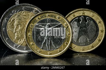 Italian one and two Euro coins are pictured beside a German one