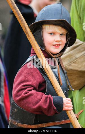 London, UK. 29th Jan, 2023. A young boy takes part in the event. Volunteers and soldiers of the King's Army, the Royalist part of the English Civil War Society, march down The Mall and via Horse Guards to Banqueting House in Westminster to commemorate King Charles I. The re-enactment takes place each year on the last Sunday to mark the anniversary of King Charles I's beheading outside Banqueting House. Credit: Imageplotter/Alamy Live News Stock Photo