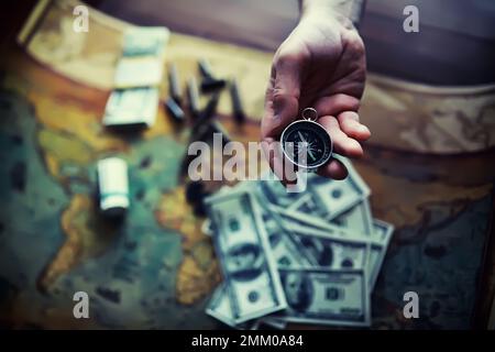 Magnetic compass. The concept of finding successful solutions to problems. Compass, map, sleeves, hands. Stock Photo