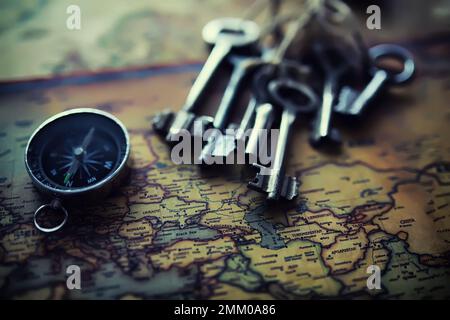 Magnetic compass. The concept of finding successful solutions to problems. Compass, map, sleeves, hands. Stock Photo