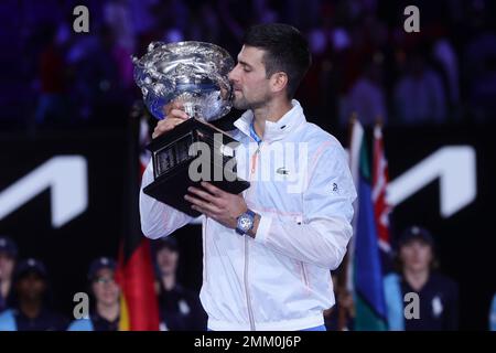 Melbourne, Australia. 29th Jan, 2023. Novak Djokovic of Serbia kisses his champions trophy after defeating Stefanos Tsitsipas of Greece 6-3 7-6 7-6 during the MenÕs Final match, Day 14 at the Australian Open Tennis 2023 at Rod Laver Arena, Melbourne, Australia on 29 January 2023. Photo by Peter Dovgan. Editorial use only, license required for commercial use. No use in betting, games or a single club/league/player publications. Credit: UK Sports Pics Ltd/Alamy Live News Stock Photo