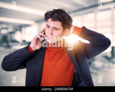 Handsome young businessman talking on cell phone Stock Photo