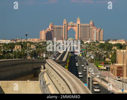 Monorail train approaching The Palm Atlantis luxury hotel on artificial Palm Jumeirah island in Dubai United Arab Emirates Stock Photo