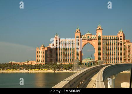 Monorail train approaching The Palm Atlantis luxury hotel on artificial Palm Jumeirah island in Dubai United Arab Emirates Stock Photo