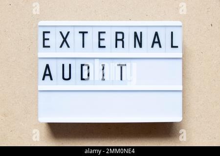 Lightbox with word external audit on wood background Stock Photo
