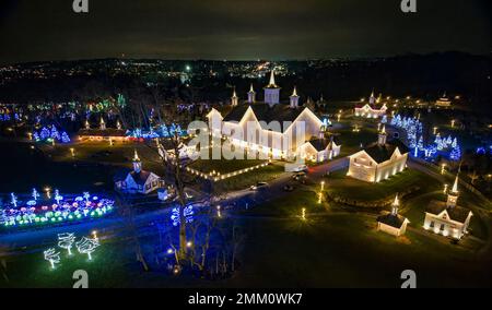 An Aerial View of a Large Christmas Drive Thru Display, with Multi Colored Lights, Seen at Night Stock Photo
