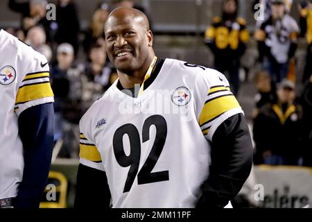 Former Pittsburgh Steelers defensive lineman Aaron Smith, acknowledges fans  during a halftime ceremony honoring former Steelers players during halftime  of the NFL football game between the Pittsburgh Steelers and the Los Angeles