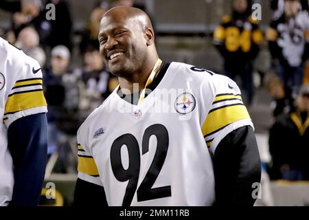 Former Pittsburgh Steelers defensive lineman Aaron Smith, acknowledges fans  during a halftime ceremony honoring former Steelers players during halftime  of the NFL football game between the Pittsburgh Steelers and the Los Angeles