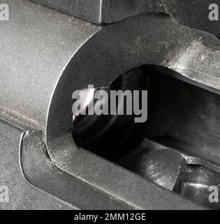 No cartridge inside a bolt action rifle chamber with light coming through Stock Photo