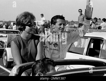 https://l450v.alamy.com/450v/2mm1387/mario-andretti-and-his-wife-dee-ann-of-nazareth-penn-take-a-victory-lap-in-the-pace-car-after-andretti-piloted-a-rear-engine-ford-to-a-new-track-record-in-milwaukee-wisc-aug-20-1967-andretti-bettered-a-record-set-by-parnelli-jones-in-1964-of-104755-miles-per-hour-with-a-new-average-speed-of-05385-miles-per-hour-ap-photopaul-shane-2mm1387.jpg