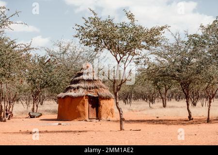 Closeup of traditional hut of himba tribes in Namibia, Africa. Tupical himbas people house from red clay and trees branches Stock Photo