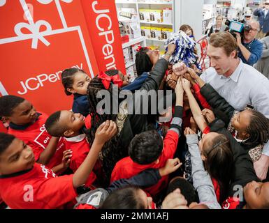 IMAGE DISTRIBUTED FOR JCPENNEY - Dallas Cowboys linebacker Sean Lee, left,  shops alongside Ajion Lair, 18, from the Boys & Girls Club of Greater Dallas  as he selects gifts for his family