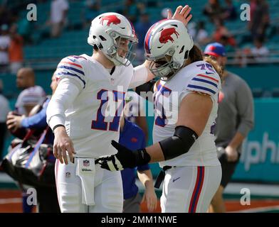 Buffalo Bills guard Wyatt Teller (75) and tackle Dion Dawkins (73) block at  the line of scrimmage during the second half of an NFL football game  against the New York Jets, Sunday,