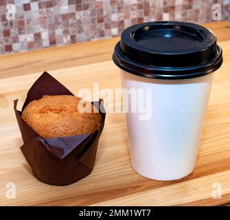 Coffee and muffin on the table Stock Photo