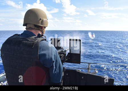220913-N-N3764-1003  CARIBBEAN SEA - (Sept. 13, 2022) -- Gunners Mate 1st Class Bradley Westcott fires the M2A1 .50-caliber machine gun during a crew serve weapons shoot aboard the Freedom-variant littoral combat ship USS Billings (LCS 15) in the Caribbean Sea, Sept. 13, 2022. Billings is deployed to the U.S. 4th Fleet area of operations to support Joint Interagency Task Force South’s mission, which includes counter-illicit drug trafficking missions in the Caribbean and Eastern Pacific. Stock Photo