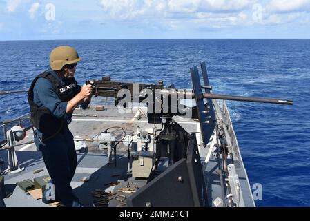 220913-N-N3764-1005  CARIBBEAN SEA - (Sept. 13, 2022) – Chief Select Gunner’s Mate Zach Morrill fires an M2A1 .50-caliber machine gun during a crew serve weapons shoot aboard the Freedom-variant littoral combat ship USS Billings (LCS 15) in the Caribbean Sea, Sept. 13, 2022. Billings is deployed to the U.S. 4th Fleet area of operations to support Joint Interagency Task Force South’s mission, which includes counter-illicit drug trafficking missions in the Caribbean and Eastern Pacific. Stock Photo