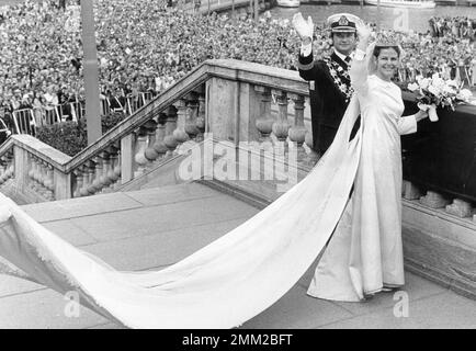 Wedding dress train being lifted by a woman Stock Photo Alamy