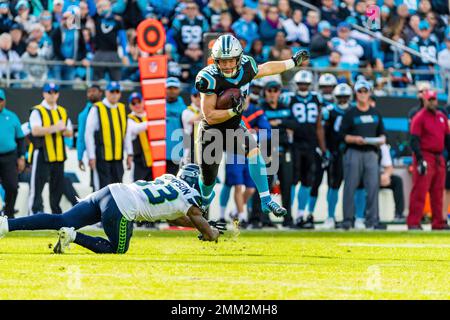 Seattle Seahawks free safety Tedric Thompson, lower left, intercepts a pass  intended for Los Angeles Rams tight end Gerald Everett, right, as outside  linebacker K.J. Wright (50) looks on, during the second