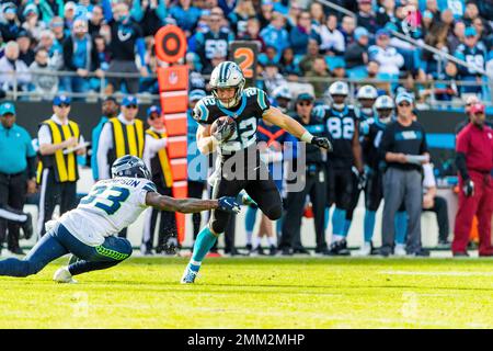 Seattle Seahawks free safety Tedric Thompson, lower left, intercepts a pass  intended for Los Angeles Rams tight end Gerald Everett, right, as outside  linebacker K.J. Wright (50) looks on, during the second