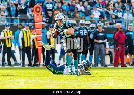 Seattle Seahawks free safety Tedric Thompson, lower left, intercepts a pass  intended for Los Angeles Rams tight end Gerald Everett, right, as outside  linebacker K.J. Wright (50) looks on, during the second