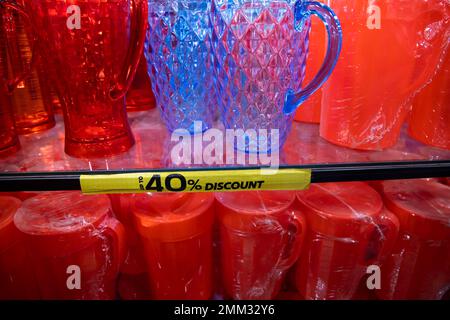 Colorful Plastic jug on a shelf in a supermarket, closeup of photo Stock Photo