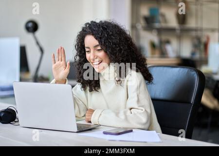 Happy business woman having videocall work hybrid meeting in office. Stock Photo